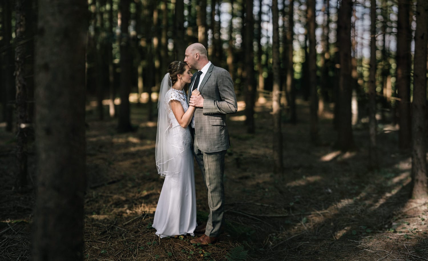 couple in the woods kissing